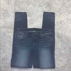 Buckle black skinny jeans